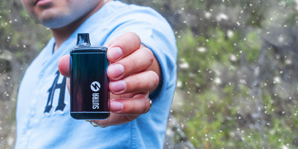 Man holding Sutra SILO Pro with snow falling nearby