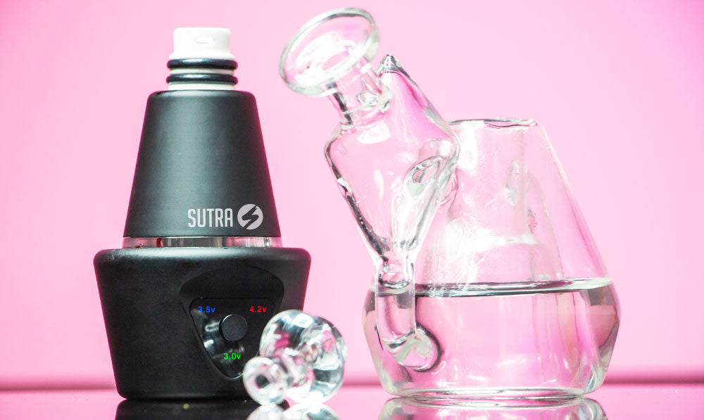 Sutra DBR Pro disassembled on reflective surface in front of pink studio background