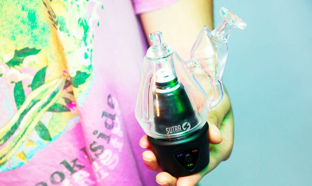 Woman holding dirty Sutra DBR Pro with no water inside