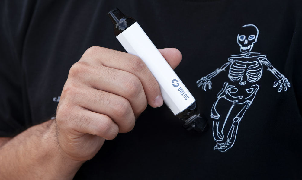 Man in T-shirt with skeleton design holding Sutra SILO