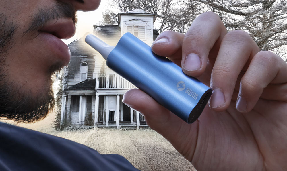 Man using Sutra Auto in front of haunted house