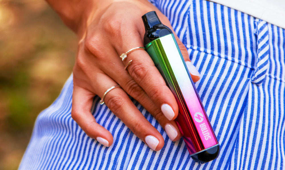Person in a striped shirt holding a Sutra Silo 510 thread battery