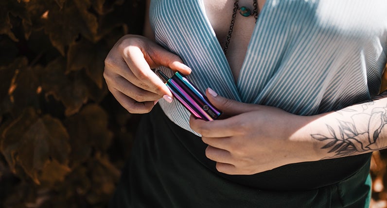 Woman at park holding the Full Color Sutra Auto