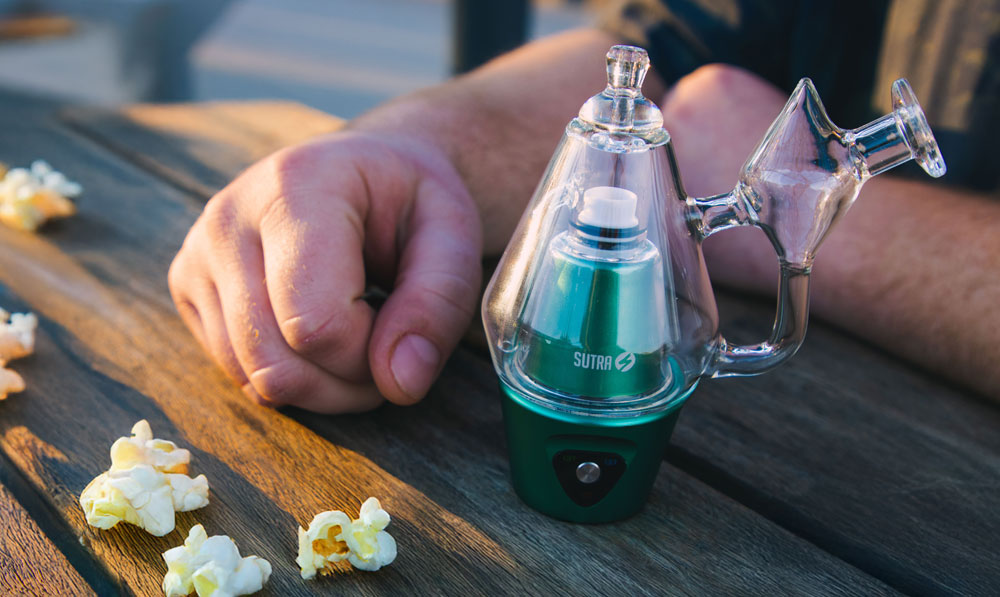 man with Sutra DBR Pro and popcorn on table